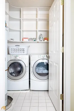 a bedroom with a bed lamps and window