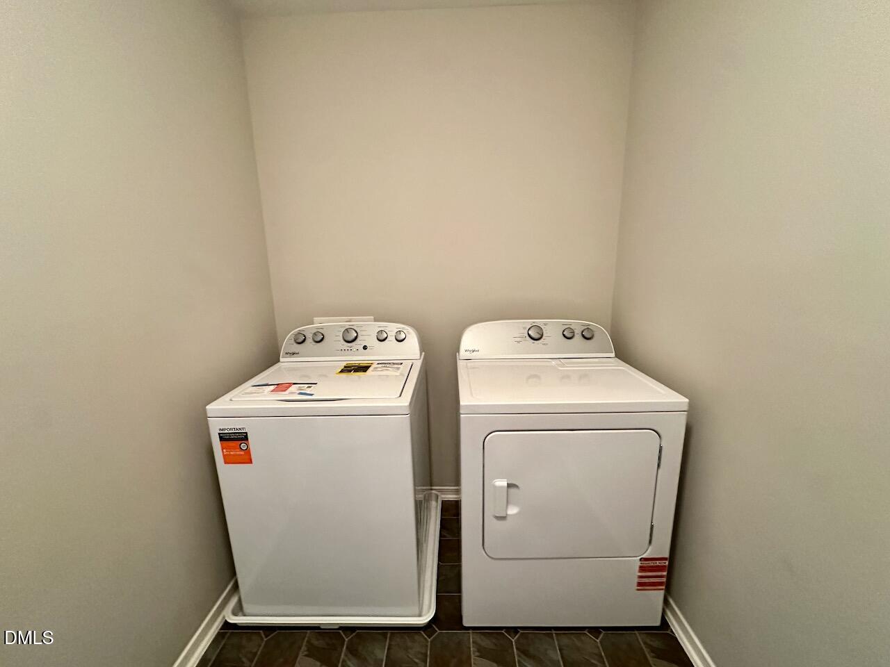 8208 Stone Cellar Drive Raleigh, NC 27613 - Photo 30 of 34 a utility room with dryer and washer