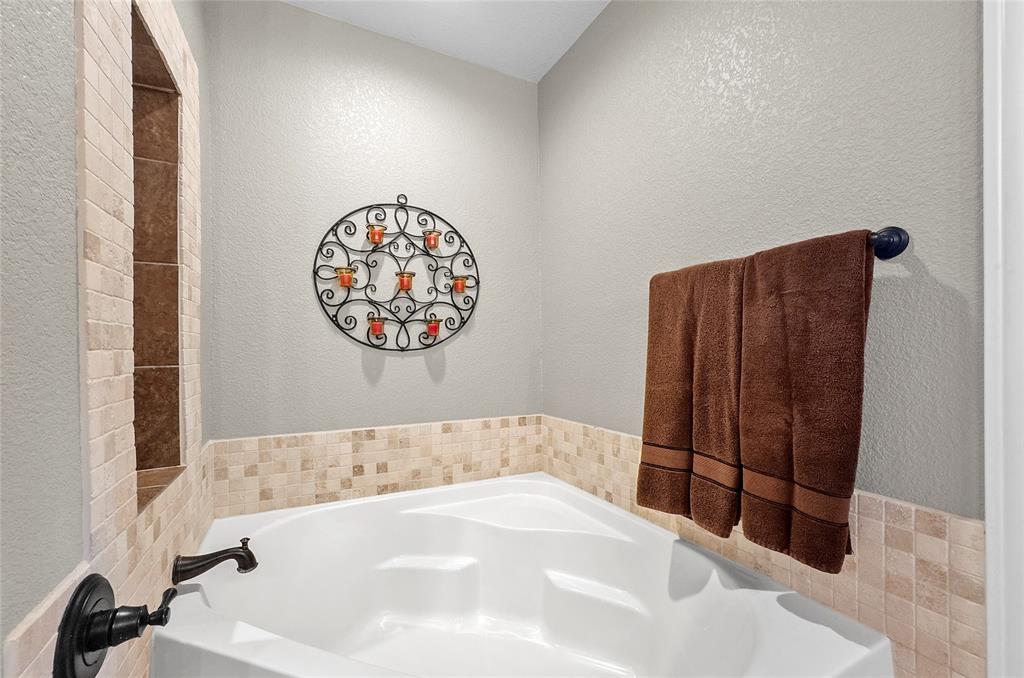 459 Pr Road 2625 Decatur, TX 76234 - Photo 11 of 40 a bathroom with a bathtub and a shower