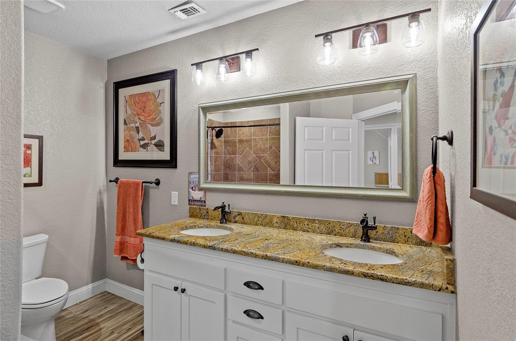 459 Pr Road 2625 Decatur, TX 76234 - Photo 14 of 40 a bathroom with a granite countertop sink toilet and mirror