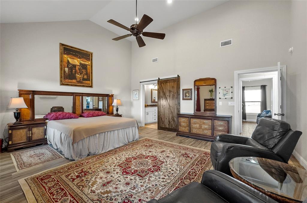 459 Pr Road 2625 Decatur, TX 76234 - Photo 8 of 40 a bedroom with a bed and wooden floor