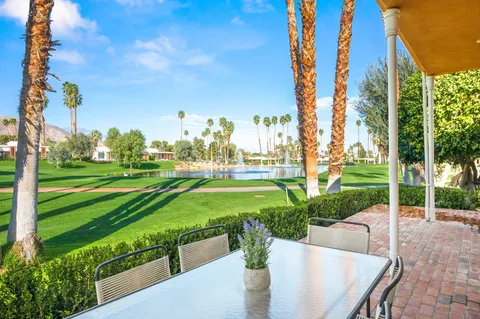 a garden view with a sitting space