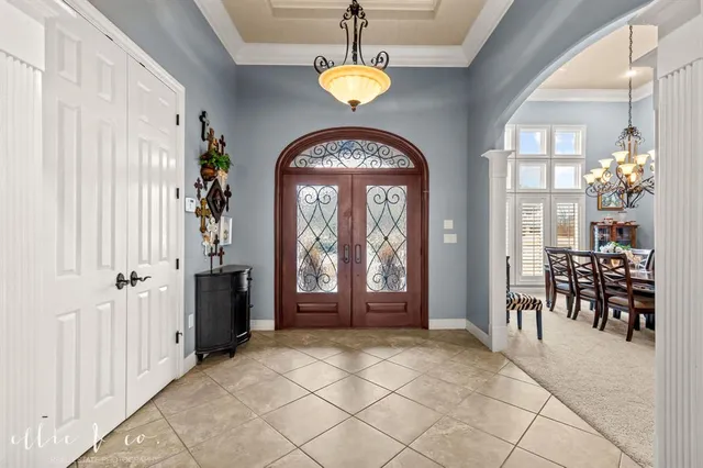 a view of hall way with furniture