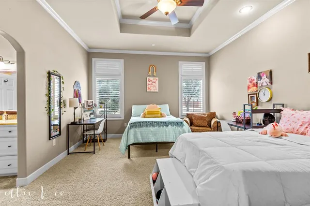 a bedroom with furniture and a window