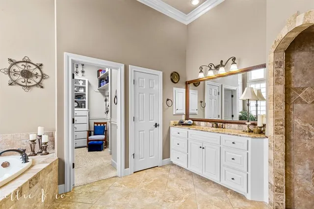 a view of a hallway with bathroom and front door
