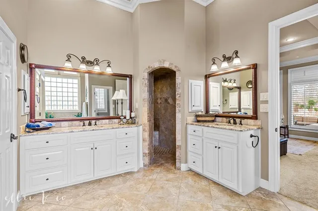 a view of a bedroom with baby crib and furniture