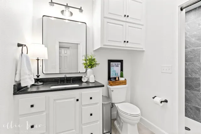 a bedroom with a bed and a table