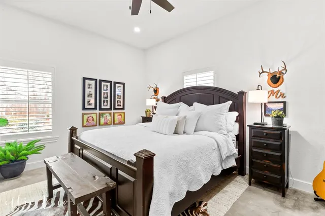 a bed room with a bed and a large mirror