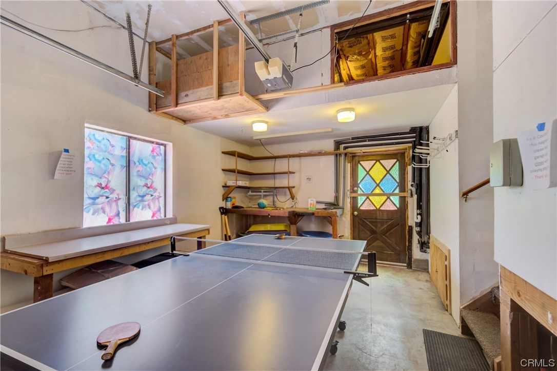 1017 Burnt Mill Road Lake Arrowhead, CA 92352 - Photo 14 of 32 a view of a livingroom with furniture and a flat screen tv