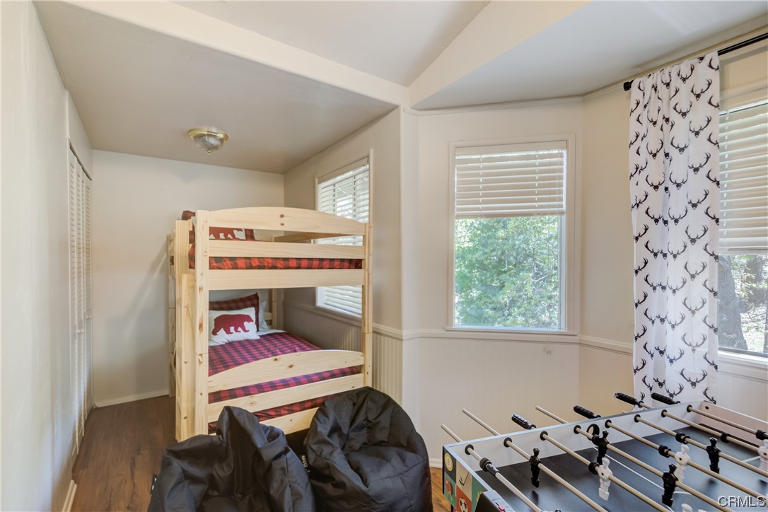 1017 Burnt Mill Road Lake Arrowhead, CA 92352 - Photo 19 of 32 a bedroom with a bed and a window
