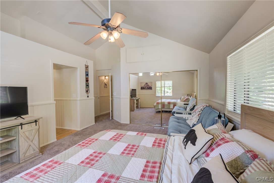 1017 Burnt Mill Road Lake Arrowhead, CA 92352 - Photo 23 of 32 a bed room with a bed a television and a couch