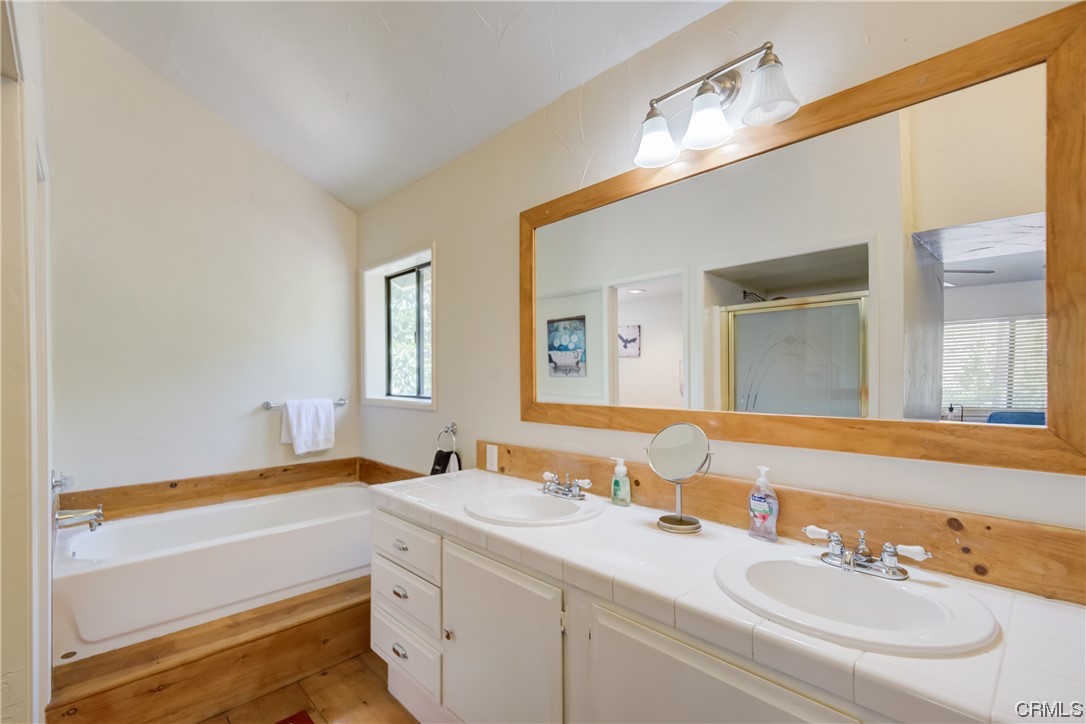 1017 Burnt Mill Road Lake Arrowhead, CA 92352 - Photo 25 of 32 a bathroom with a sink and a mirror