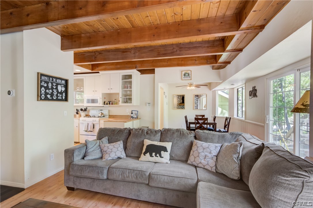 1017 Burnt Mill Road Lake Arrowhead, CA 92352 - Photo 5 of 32 a living room with furniture and a large window
