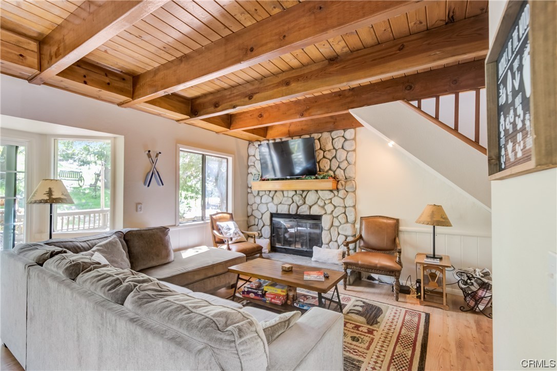 1017 Burnt Mill Road Lake Arrowhead, CA 92352 - Photo 6 of 32 a living room with furniture and a fireplace