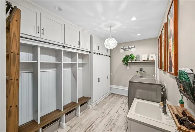 a kitchen with granite countertop a sink stainless steel appliances and cabinets