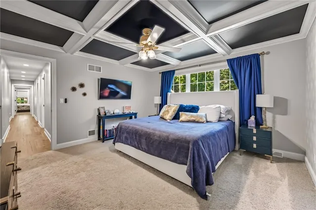 a bedroom with a large bed and a large window