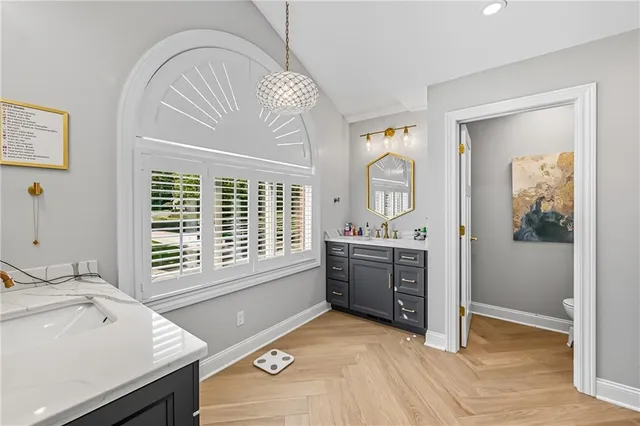 a room with a window and a sink