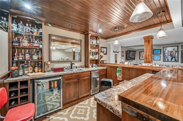 a open kitchen with stainless steel appliances granite countertop sink stove and cabinets