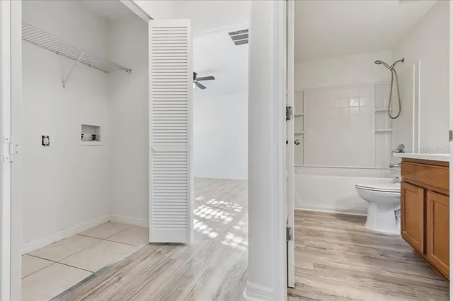 a bathroom with a toilet and shower