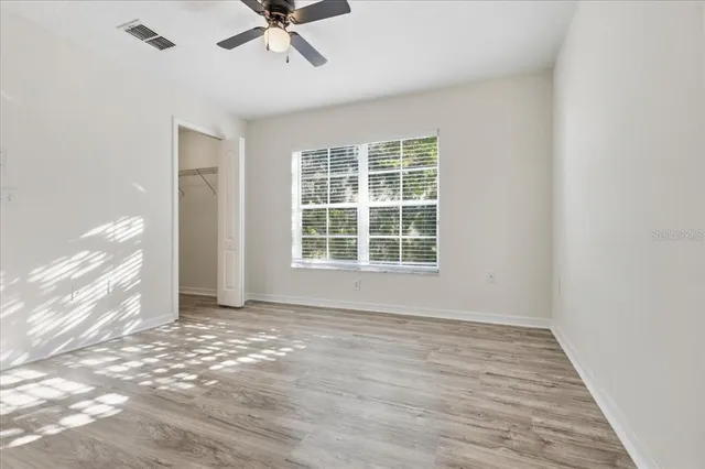 a view of an empty room with a window