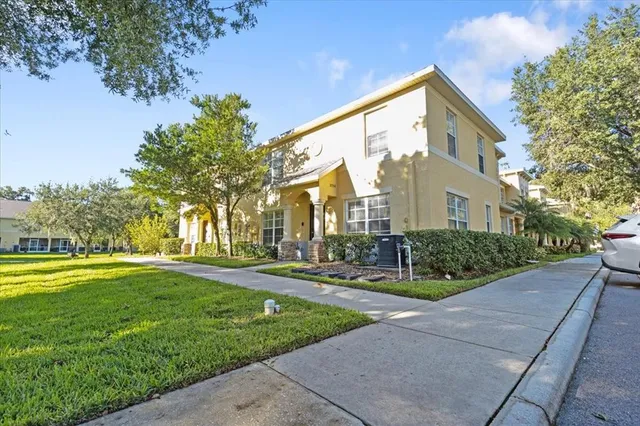 a front view of house with yard and green space