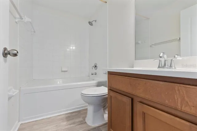 a bathroom with a sink a toilet and a bathtub