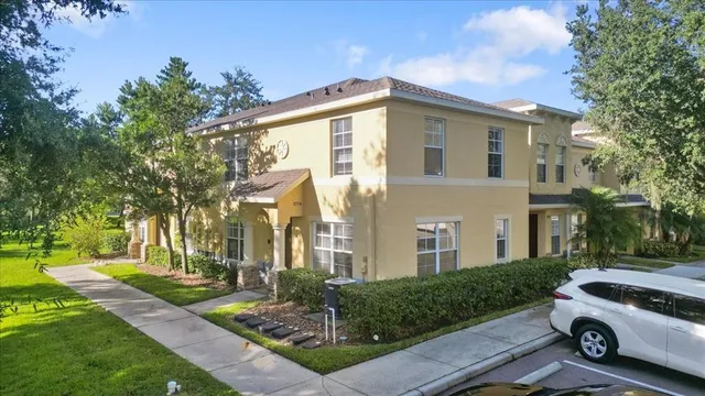 a view of a car parked in front of a house