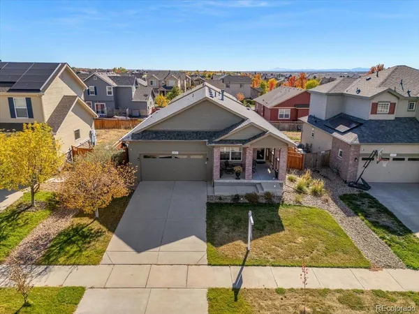 a aerial view of a house with a yard