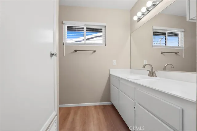 a bathroom with a sink a vanity and a mirror