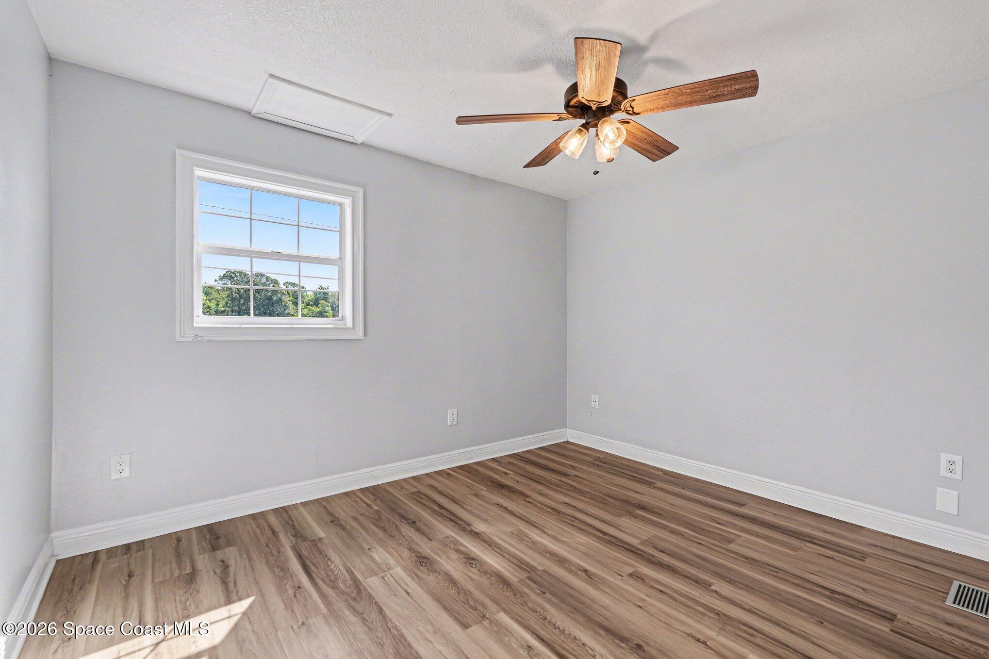 4950 Blounts Ridge Road Mims, FL 32754 - Photo 18 of 40 a view of room with window and ceiling fan