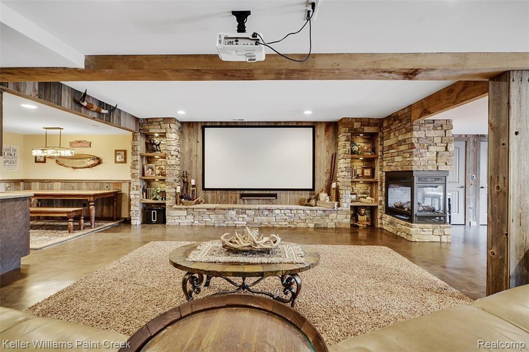 525 Sheldon Court Rochester, MI 48306 - Photo 49 of 66 A media room like no other. Built in shelves made of stone and Reclaimed Barnwood. It's all in the details.