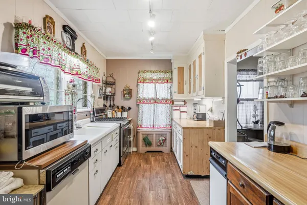 a kitchen with stainless steel appliances a sink and a stove