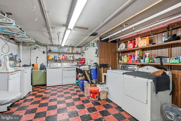 a bedroom with furniture and a flat screen tv