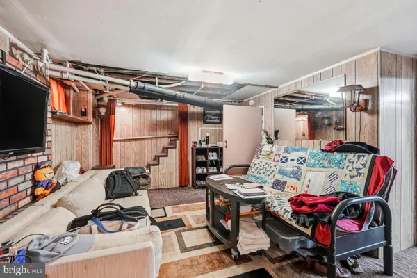 a kitchen with stainless steel appliances granite countertop a sink cabinets and a large window