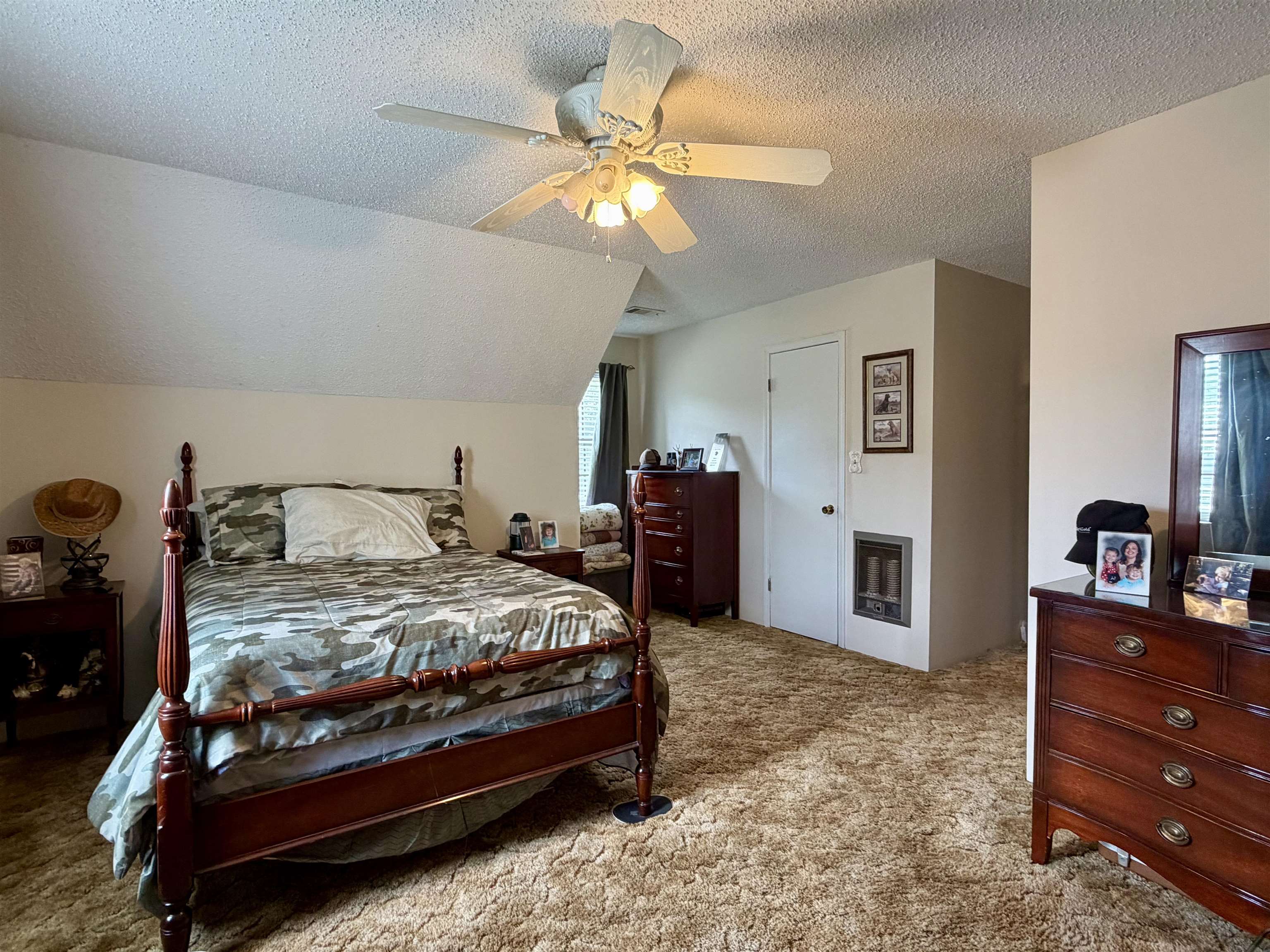 142 Treece Street Selmer, TN 38375 - Photo 18 of 36 Carpeted room featuring an angled ceiling plane and a ceiling fan with light fixture