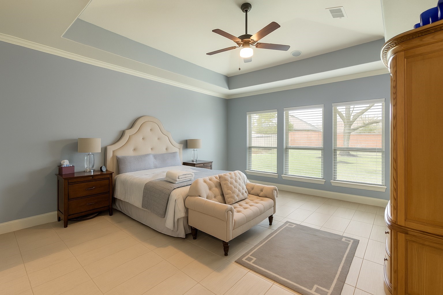 17610 Astrachan Road Richmond, TX 77407 - Photo 15 of 25 a spacious bedroom with a bed and a couch
