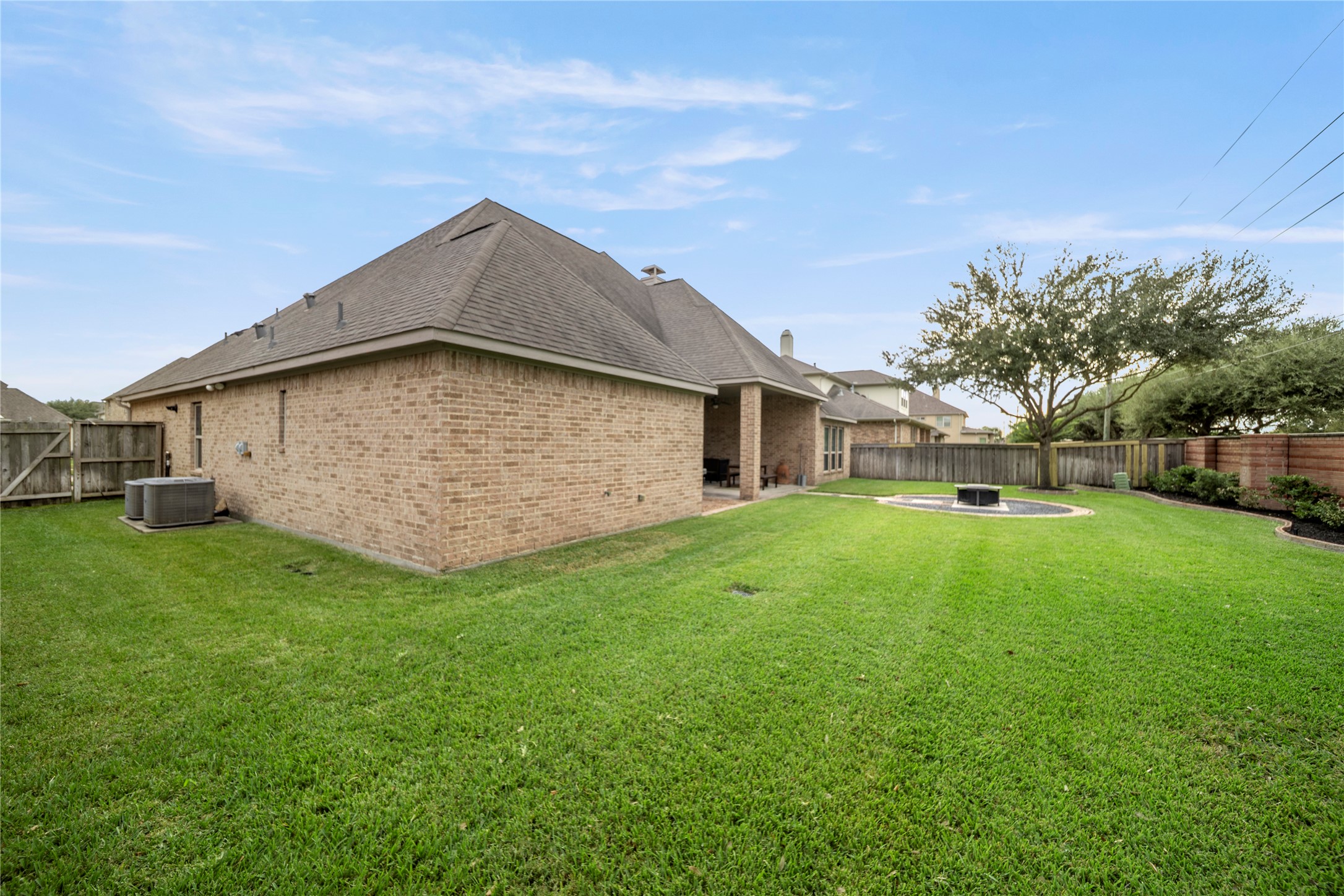 17610 Astrachan Road Richmond, TX 77407 - Photo 24 of 25 a view of a house with backyard and garden