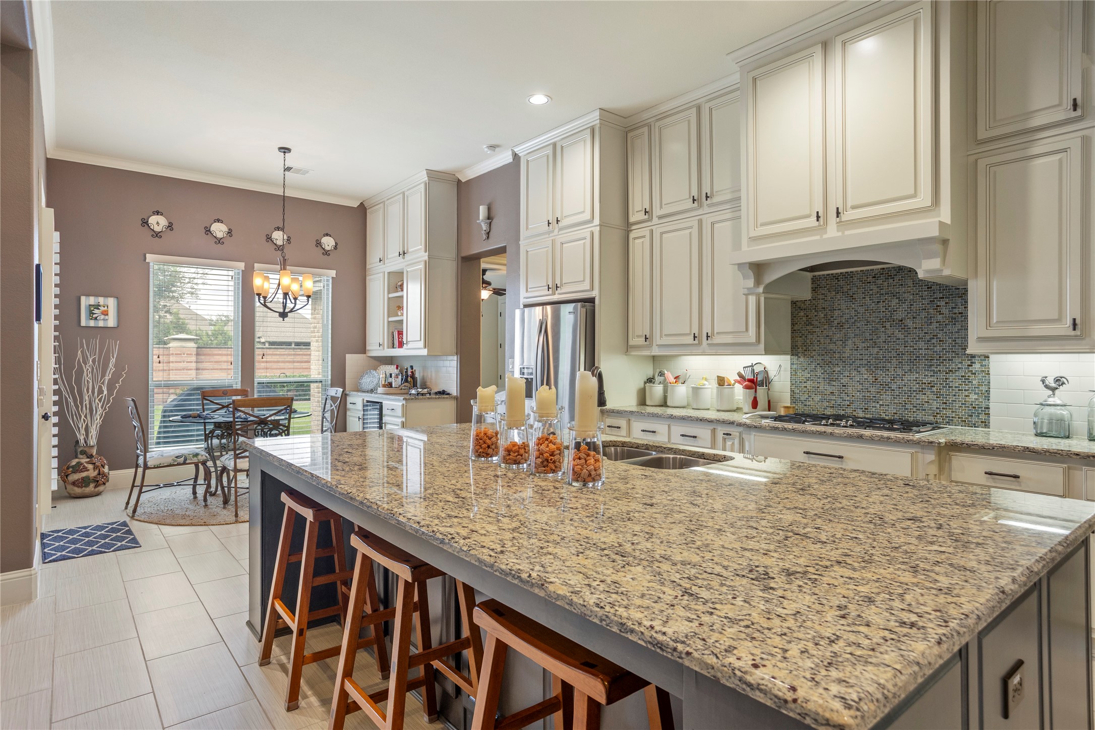 17610 Astrachan Road Richmond, TX 77407 - Photo 9 of 25 a kitchen with granite countertop a sink and cabinets
