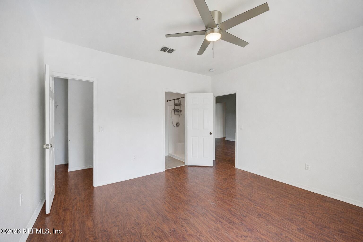 10961 Burnt Mill Road, Unit 824 Jacksonville, FL 32256 - Photo 12 of 35 a view of an empty room with wooden floor