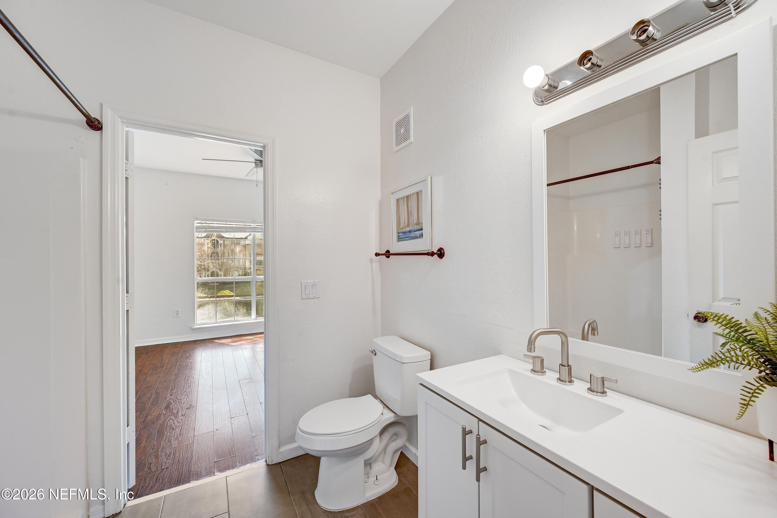 10961 Burnt Mill Road, Unit 824 Jacksonville, FL 32256 - Photo 13 of 35 a bathroom with a sink toilet and vanity