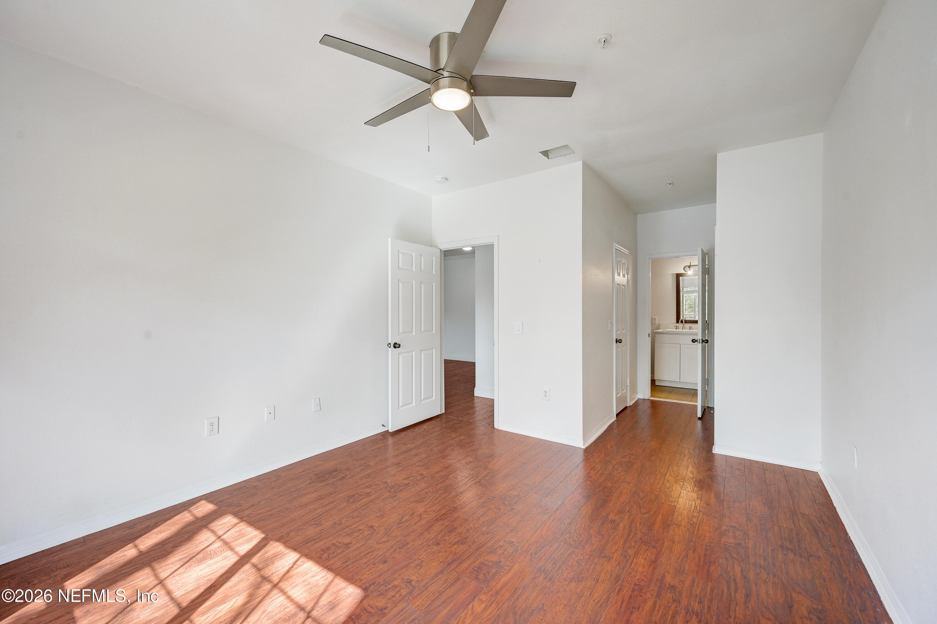 10961 Burnt Mill Road, Unit 824 Jacksonville, FL 32256 - Photo 16 of 35 wooden floor in an empty room