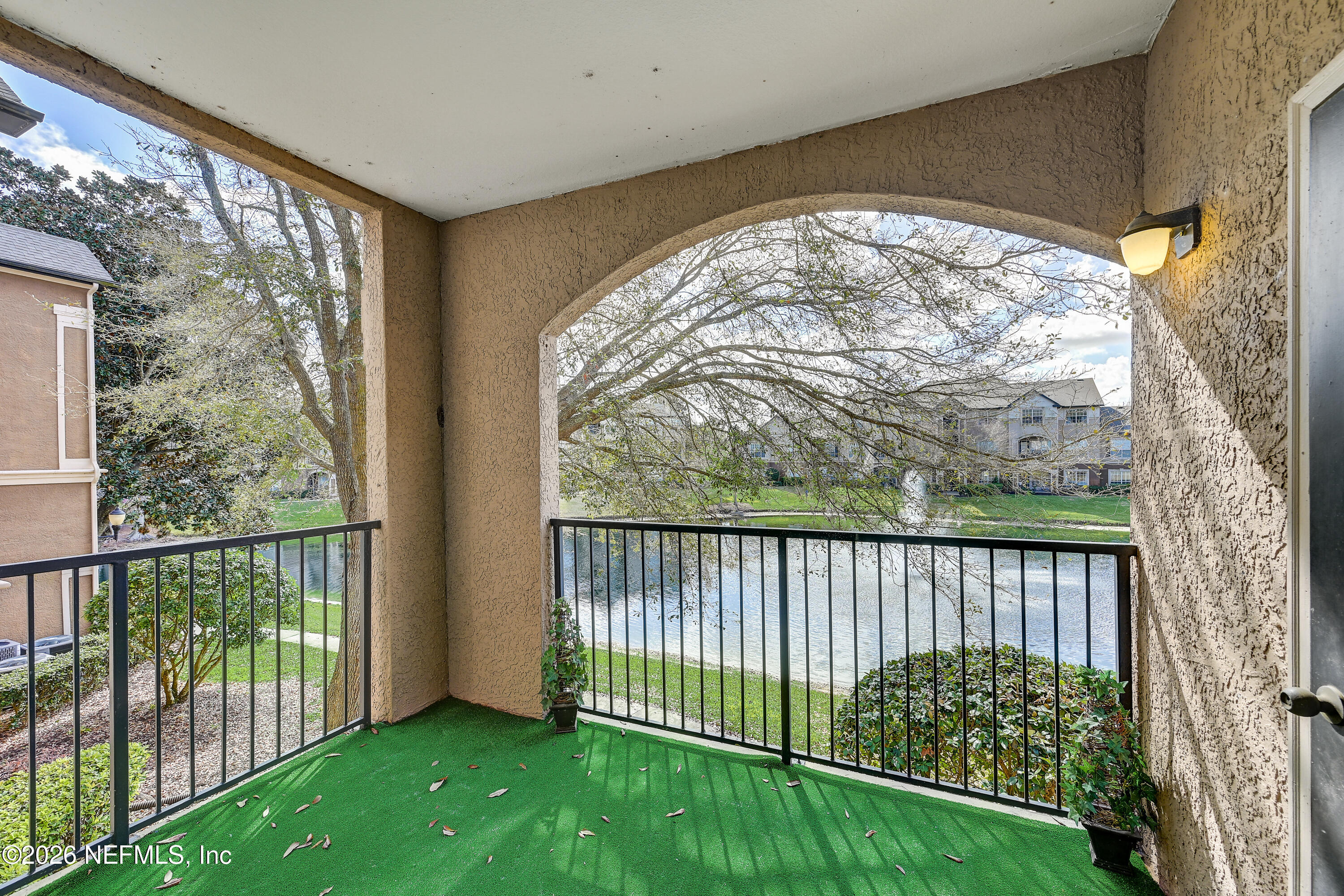 10961 Burnt Mill Road, Unit 824 Jacksonville, FL 32256 - Photo 20 of 35 a view of a garden from a porch