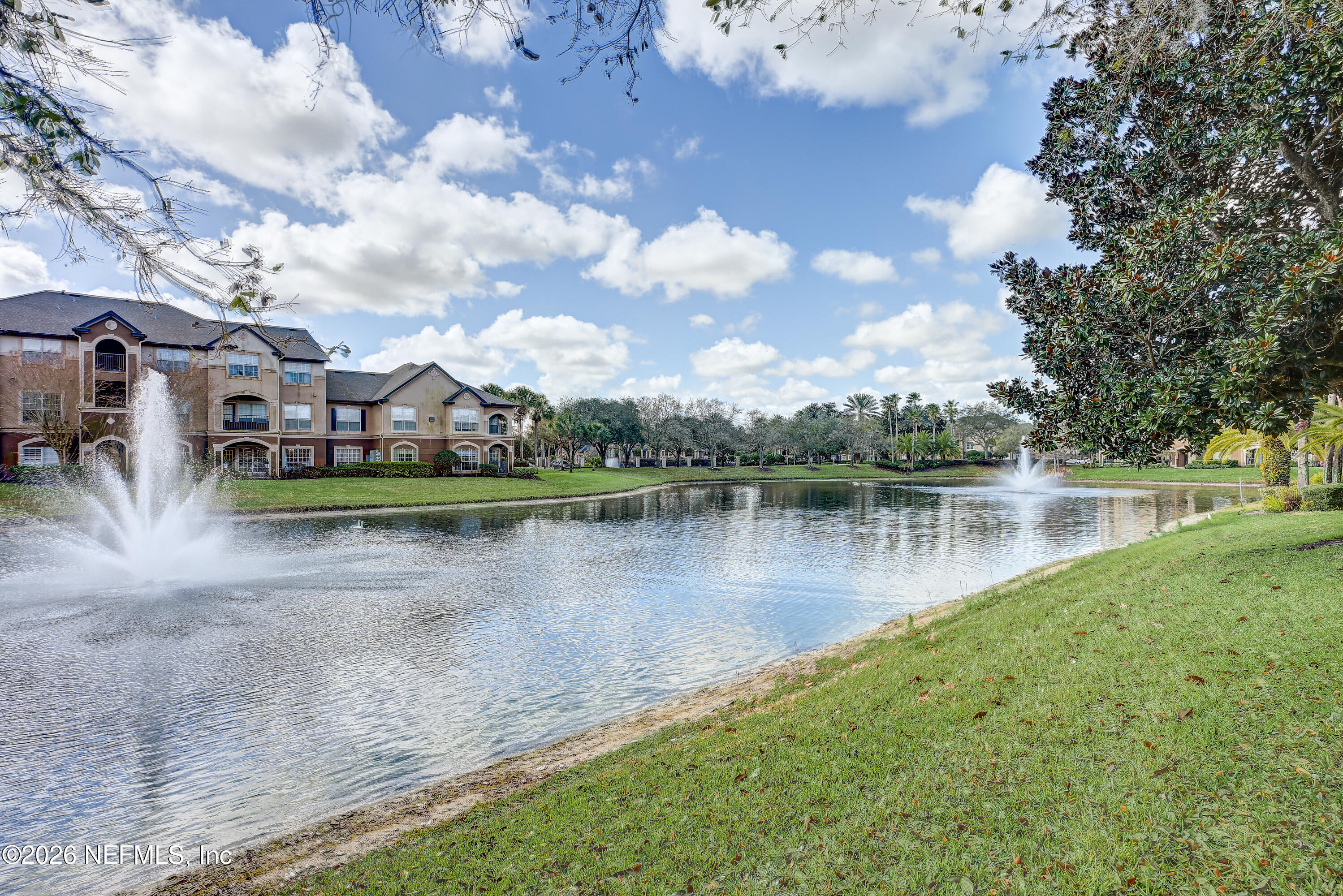 10961 Burnt Mill Road, Unit 824 Jacksonville, FL 32256 - Photo 22 of 35 a view of a lake with houses
