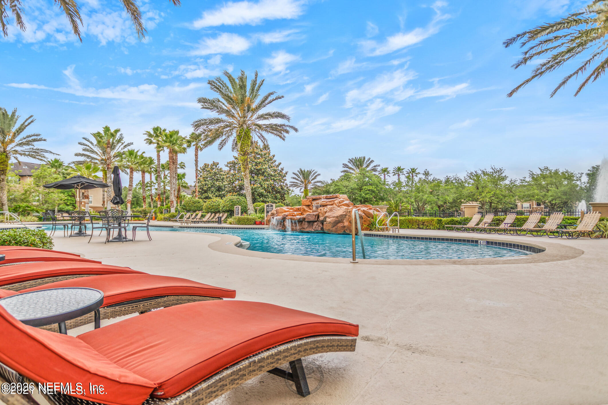 10961 Burnt Mill Road, Unit 824 Jacksonville, FL 32256 - Photo 29 of 35 a view of a swimming pool with a lounge chairs