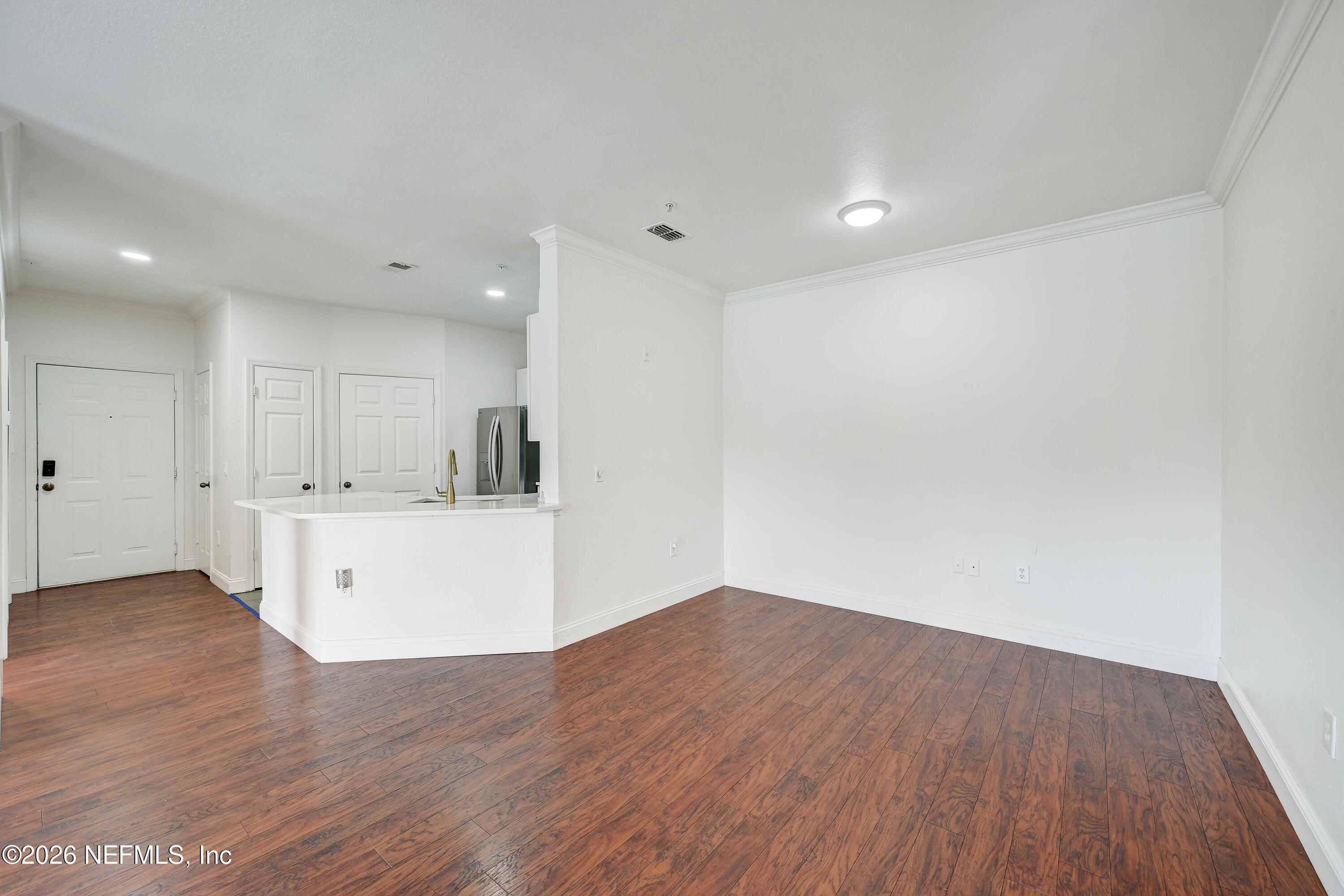 10961 Burnt Mill Road, Unit 824 Jacksonville, FL 32256 - Photo 3 of 35 a view of kitchen with wooden floor and window