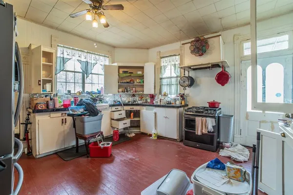 a very nice looking room with kitchen flooring and furniture