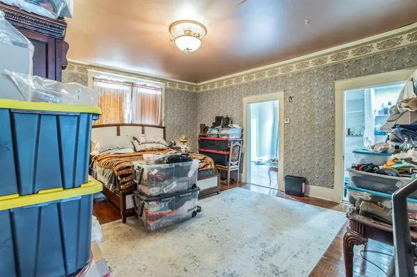a bedroom with a bed and a table in it