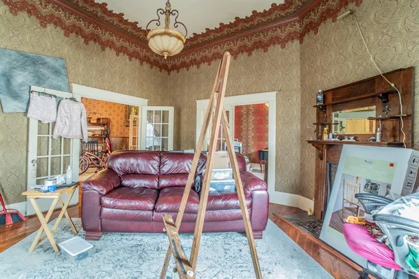 a living room with furniture a dining table and chairs