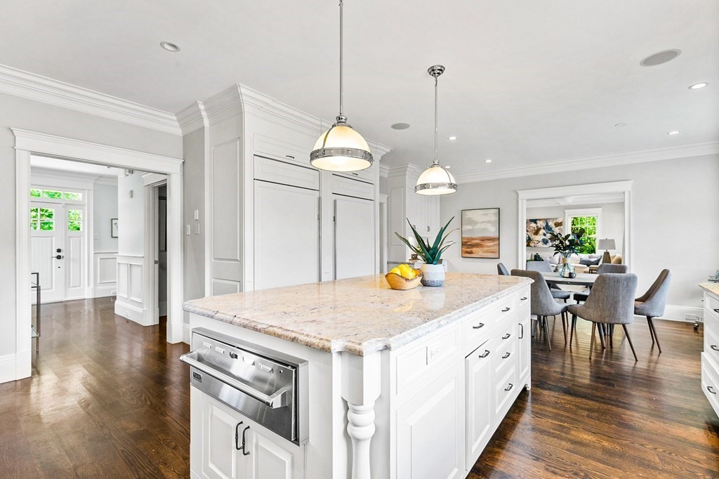 203 Old Farm Road Newton, MA 02459 - Photo 3 of 24 a kitchen that has a lot of white cabinets and wooden floor