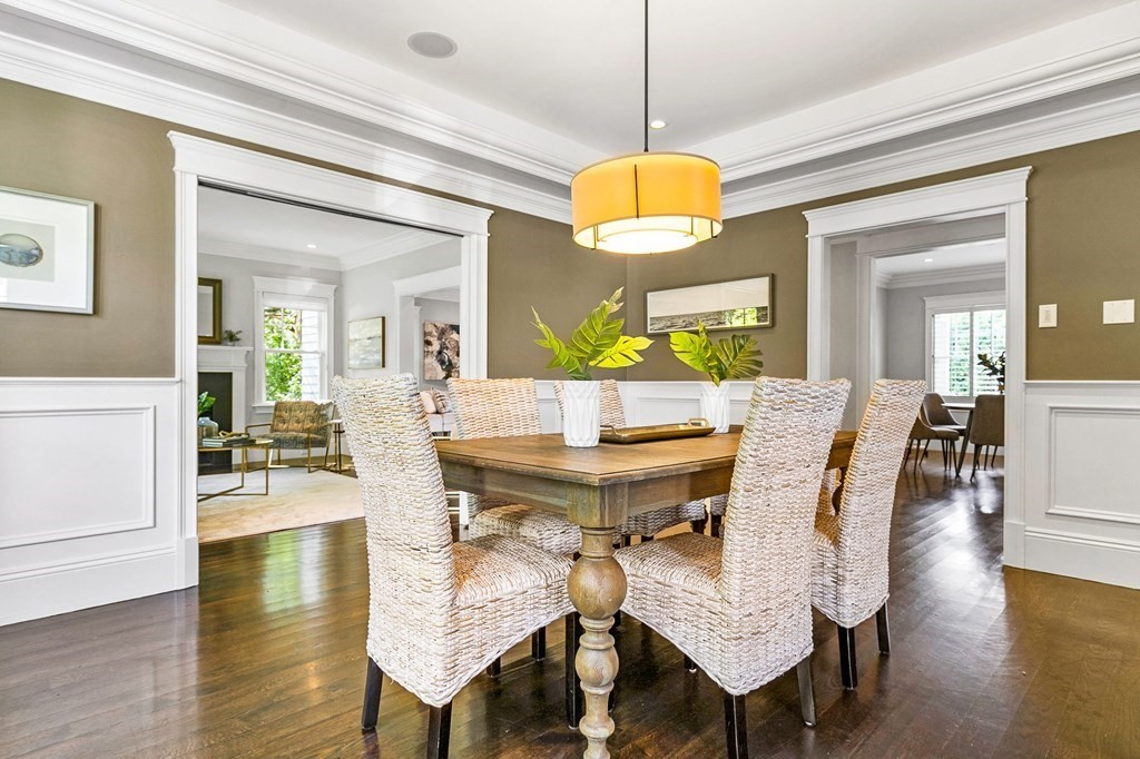 203 Old Farm Road Newton, MA 02459 - Photo 5 of 24 a view of a dining room with furniture wooden floor and chandelier